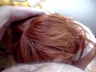 Beautiful redhead on her knees sucking cock and balls Video